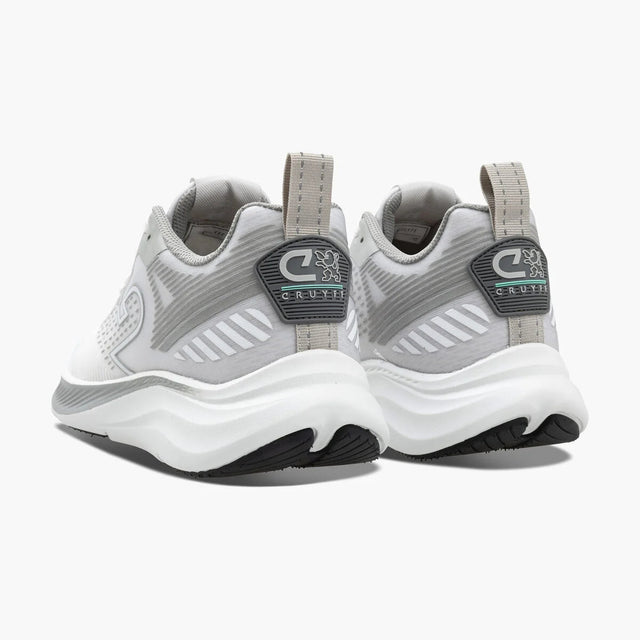 Gray and white sneakers with brand logo on a white background