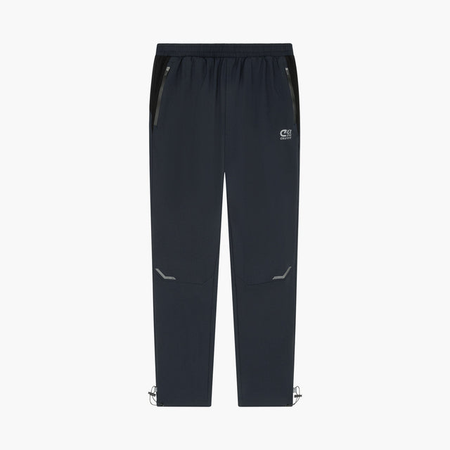 Dark navy athletic pants with zippered side pockets, a small white logo on the left thigh, and adjustable ankle cuffs, shown against a plain white background.