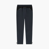 A pair of dark navy blue athletic pants with a black elastic waistband and small silver metal clips at the lower hems, shown against a plain white background.