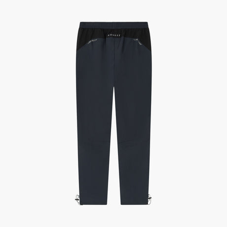 A pair of dark navy blue athletic pants with a black elastic waistband and small silver metal clips at the lower hems, shown against a plain white background.