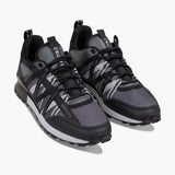 Black and gray sneakers with 'CRU' branding on a white background
