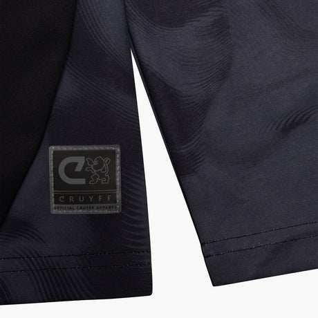 Navy blue sports shorts with a visible brand logo on a white background