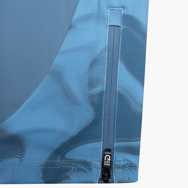 Close-up of a blue garment with a zipper on a gray background