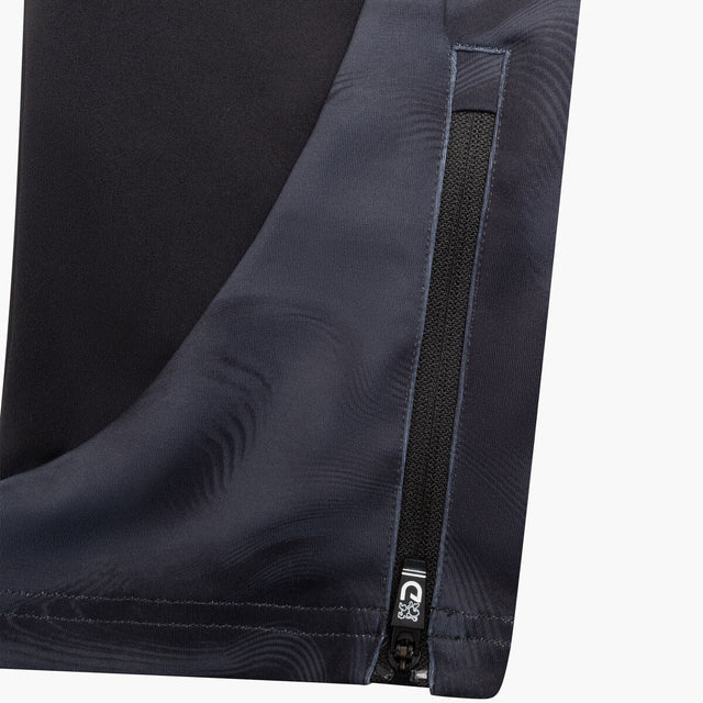 Close-up of dark blue pants with a zipper detail on a white background