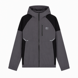 A colorblock hooded jacket in dark gray and black, featuring a full-zip front, a small white logo on the left chest, and reflective silver details on the front pockets, shown against a plain white background.