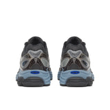 Pair of black and gray sneakers with blue accents on a white background