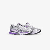 A pair of Saucony athletic sneakers in white, silver, and purple, shown from a side profile view against a light gray background.
