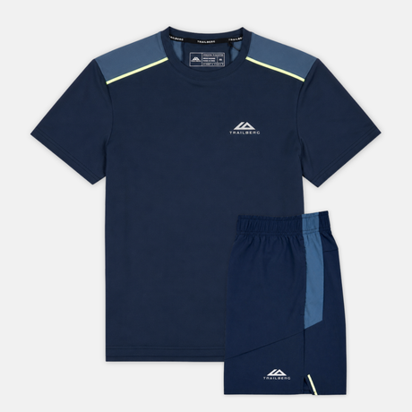 Navy athletic shirt and shorts set with visible brand logo on a light gray background